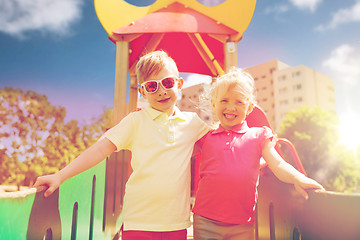 Image showing two happy kids hugging on children playground