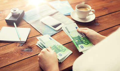 Image showing close up of traveler hands counting euro money