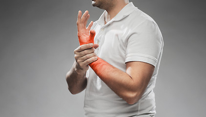 Image showing close up of man suffering from pain in hand