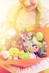 Image showing close up of woman with bunch at flower shop