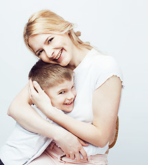 Image showing young modern blond mother with cute son together happy smiling family posing cheerful on white background, lifestyle people concept, sister and brother friends 