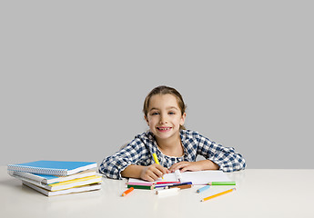 Image showing Little girl making drawings