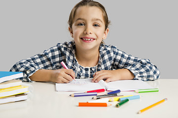 Image showing Little girl making drawings