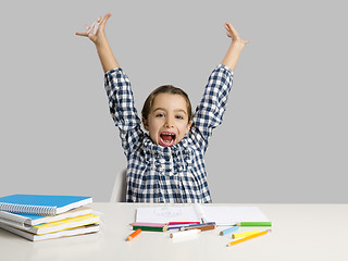 Image showing Little girl making drawings