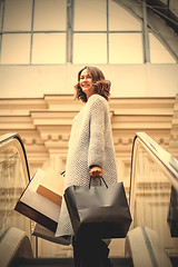 Image showing Smiling happy middle-aged woman with shopping bags 