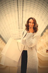 Image showing woman with packages in the mall