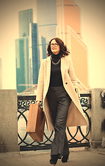 Image showing Beautiful businesswoman in a light coat