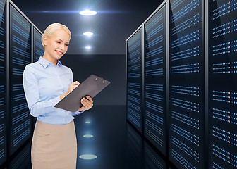 Image showing businessman with clipboard over server room