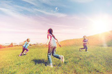 Image showing group of happy kids running outdoors