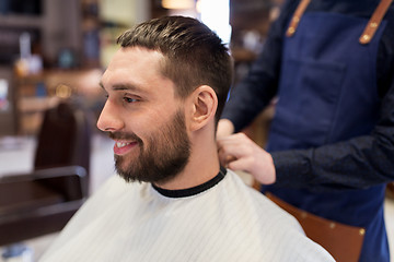 Image showing hairdresser and man with beard at barbershop