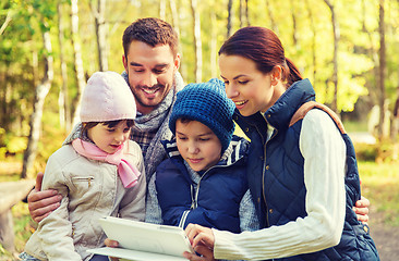 Image showing happy family with tablet pc at camp