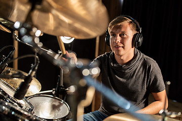 Image showing male musician playing drums and cymbals at concert