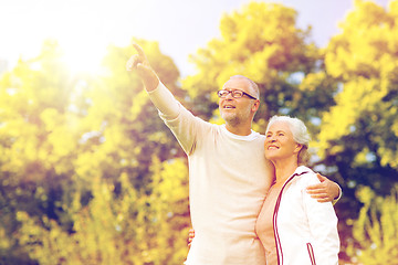 Image showing senior couple hugging in park