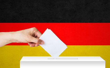 Image showing hand of german with ballot and box on election