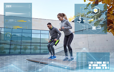 Image showing man and woman exercising on bench outdoors