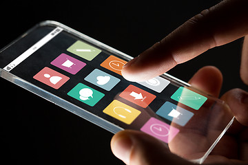 Image showing close up of businessman hand with glass smartphone