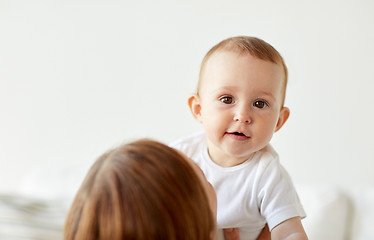 Image showing happy little baby with mother at home