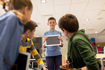 Image showing group of happy children with tablet pc at school