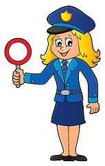 Image showing Policewoman holds stop sign theme 1