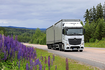 Image showing White Mercedes-Benz Actros Cargo Truck on Scenic Road