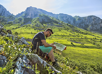 Image showing The Hiker with a Map in Mountains