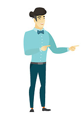 Image showing Young asian businessman pointing to the side.