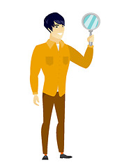 Image showing Asian business man holding hand mirror.