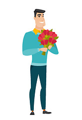 Image showing Caucasian businessman holding a bouquet of flowers