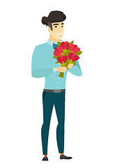 Image showing Asian businessman holding a bouquet of flowers