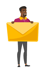 Image showing Smiling businessman holding a big envelope.