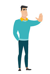 Image showing Caucasian businessman showing stop hand gesture.