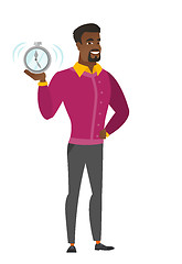 Image showing African-american business man holding alarm clock.