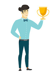 Image showing Asian business man holding a trophy.