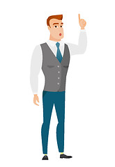 Image showing Businessman with open mouth pointing finger up.