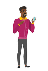 Image showing African business man holding a mobile phone.