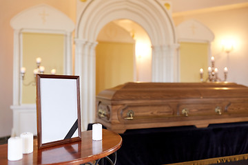 Image showing photo frame and coffin at funeral in church