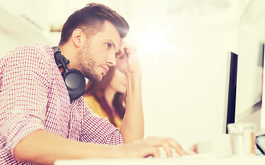 Image showing stressed software developer at office