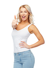 Image showing happy young woman showing thumbs up