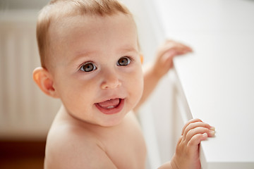 Image showing happy little baby boy or girl at home