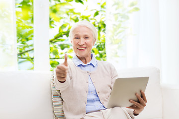 Image showing senior woman with tablet pc showing thumbs up