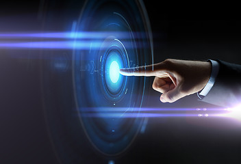 Image showing male hand pointing finger to virtual projection