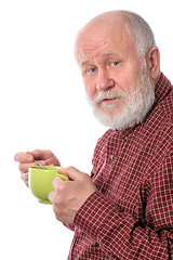 Image showing Cheerfull senior man with green cup, isolated on white