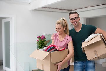 Image showing young couple moving into a new home