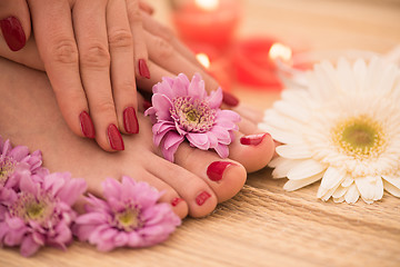 Image showing female feet and hands at spa salon