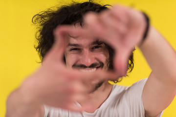 Image showing young man with funny hair over color background