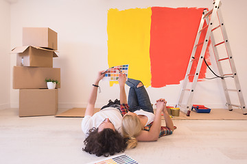 Image showing Happy young couple relaxing after painting