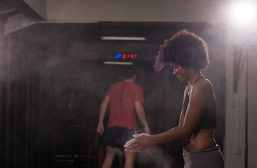 Image showing black woman preparing for climbing workout