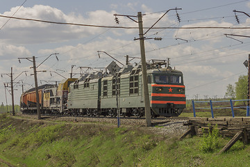 Image showing Green freight train transports cargo by rail
