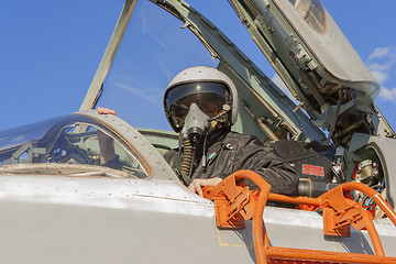 Image showing Military pilot in the cockpit of a jet aircraft