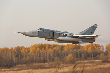 Image showing Military jet bomber Su-24 Fencer flying